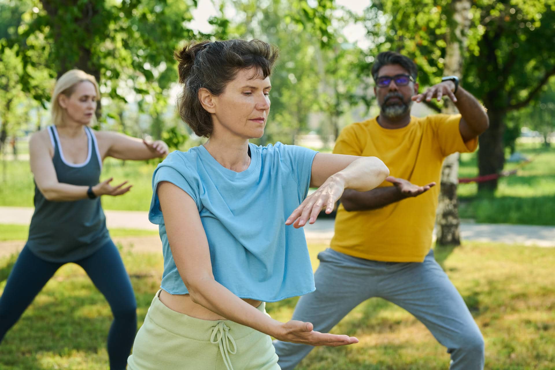 Mature woman in blue t-shirt and olive sweatpants holding arms in front of herself while doing balance exercise against active people SSUCv3H4sIAAAAAAAACnRTTW/cIBC9V8p/WPkcVNsY25tjDr1V6j3qYYDxGoWFFeBUqyj/PeCPDY62F4t54/fezDC8P/w4HAoOXoni6fCeohgrrScfHARlTYTLxxV3aCS6HHlztC1zAFQeoVTBOgU6BzkEMRo4YwTNpHWCP+Zk4QOEyaNPtayQgICnqLGAN4ml4JclPmyJORkZMVX8QXvRWDxmGT/xlPmNptjQxeU/Es8IU7j+/AV+TJO4J6W8QK3BoJ38l+hy+HsbygmNuH7Vn/jjFAI6H6x4zRuJqarfOdX1TXcTTJLScrzLLlta3WNIh3D2Qc1z3zFqujNk5T06V6fZ7jLaYL8p7OjPk1cGvb9btYbz9RsZeFNDJSVhggNpatoQqERNKGspZfHL5LAzoKJt+x44GTohSCOGkvRti+RYVTGDdcmHrIPlMN/IulEONcKyZC9LbcXrv3gX53ztYJLKZhv3ZgXo9APNlEBdwMGOd3FKKHPKEBvG+c1sSsJOJrg0hdvcCm3tBXjc1qfDEG1ww0fwPv4uNzzzFvGF2nPmY2yYe1pVCxkfTgorSruSMVofG1Yy2rB1vdbHNqqoM5ezCc3XrGTelUoVFEhhOLbICJVdRxpkgvCurUjZdy1rulpi38fBf3wCAAD//wMALznhClUEAAA=